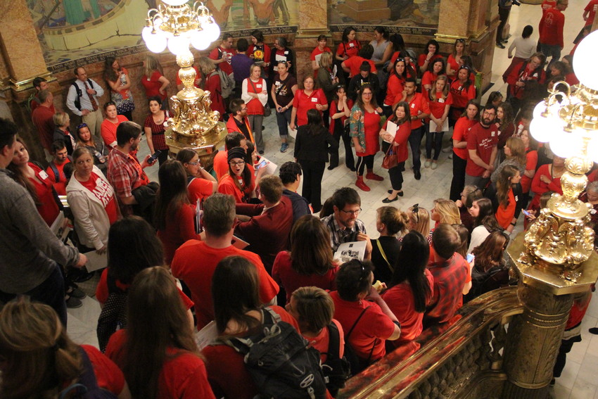 The packed stairway at the state Capitol on a “Day of Action” for educators April 16. Teachers and other education personnel wore red in solidarity as they advocated for more school funding.